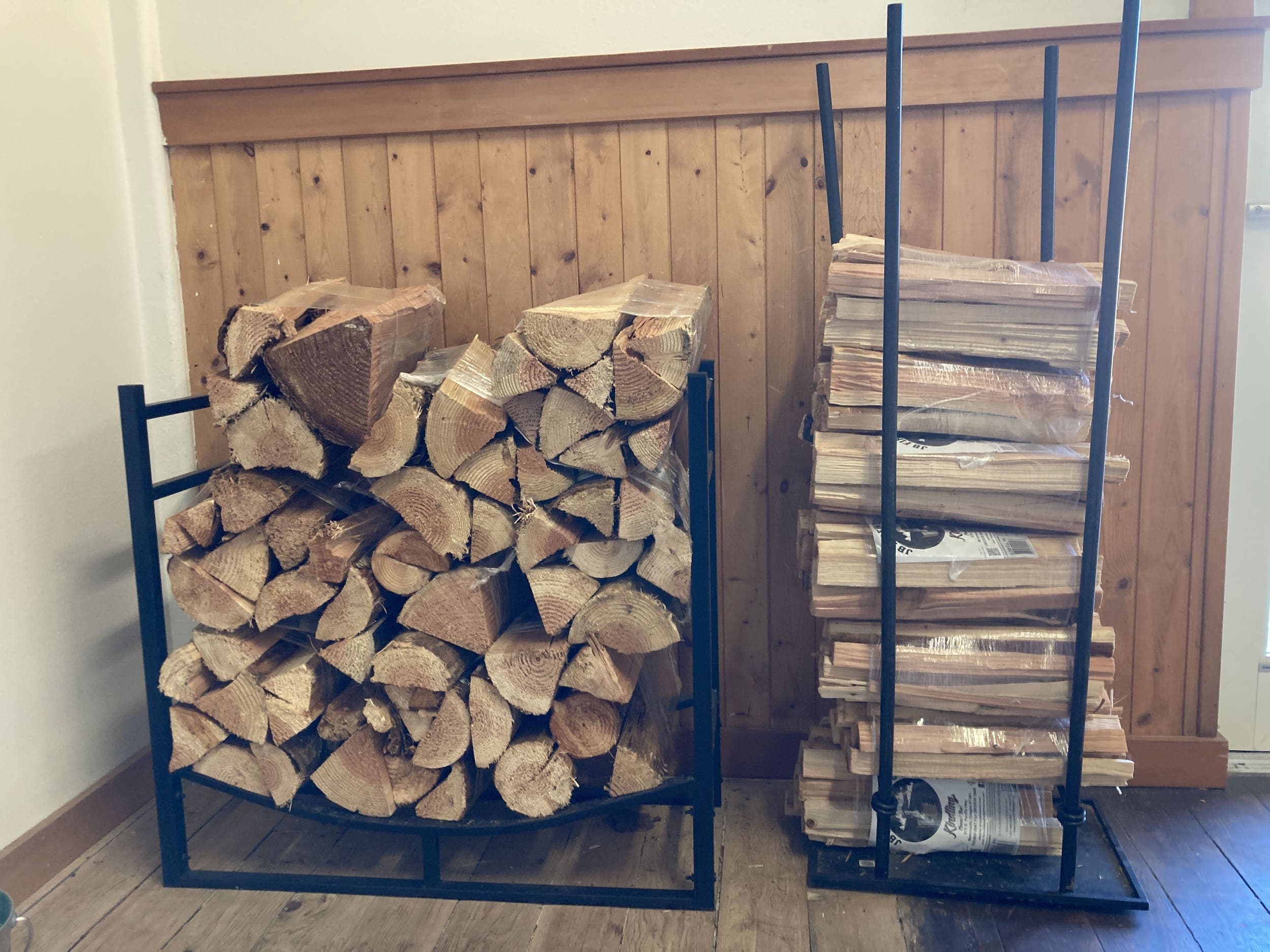A stack of fire wood inside a cottage at Harts Camp